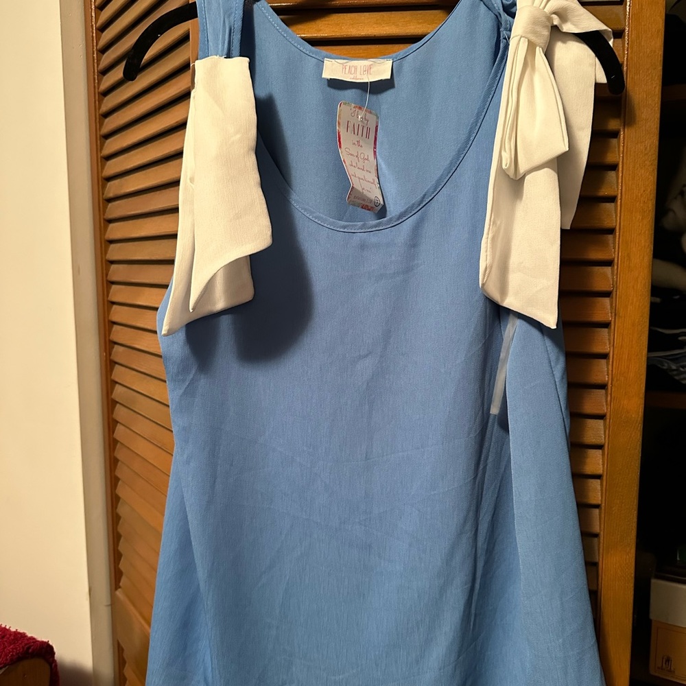 Sleeveless Blue Blouse withWhite Bows on Shoulder